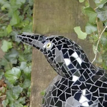 Mosaic bird sculpture. Mirror and glass tile.